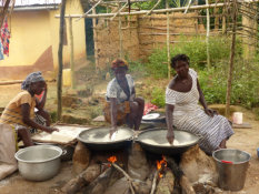 Mesomagor, woman cook the traditional Gari dish made of cassava